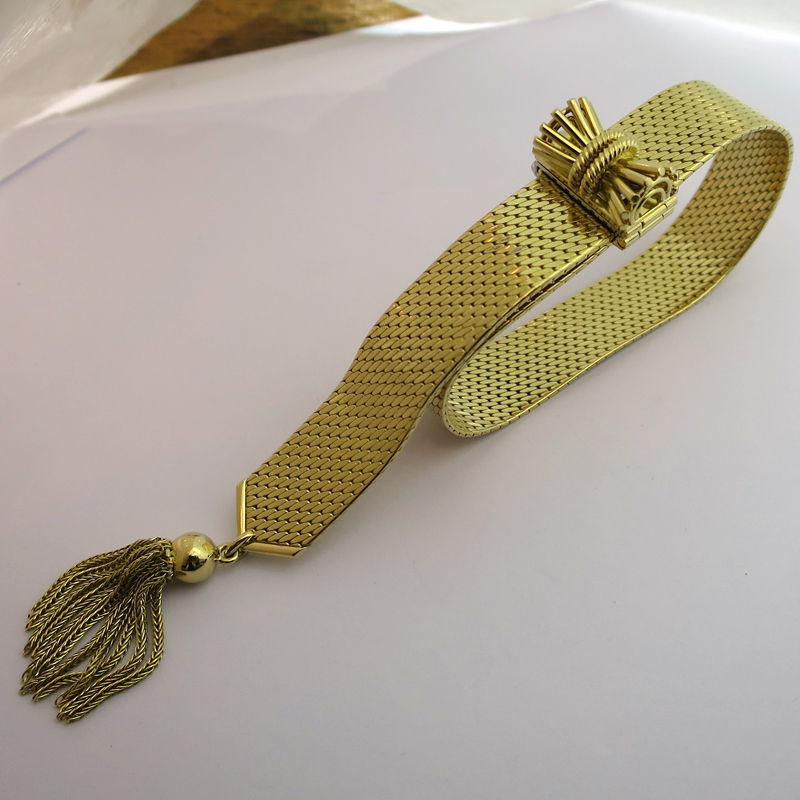 Bracelet ceinture en or jaune et pompon 176