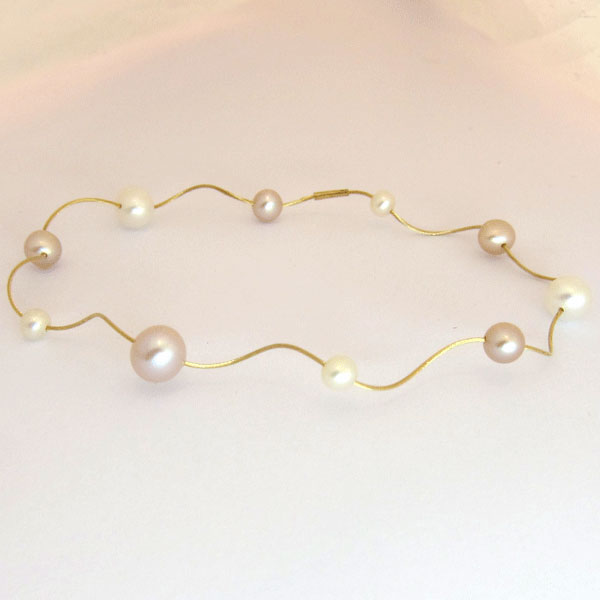 Bracelet perles et cble d'or 169